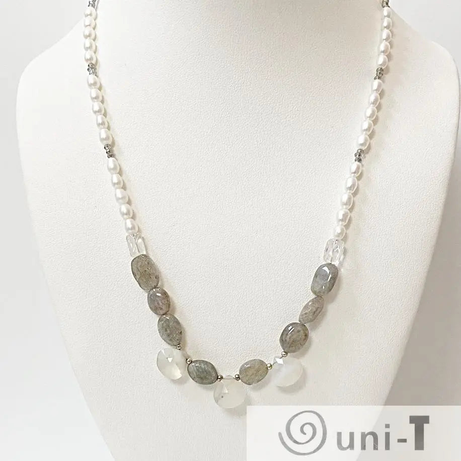 Elegant labradorite pearl necklace with quartz and opal accents shown on a display bust, ideal for formal or casual wear.