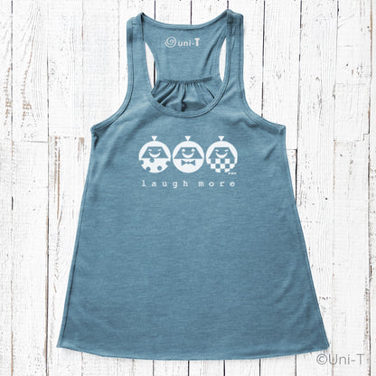 Blue women's racerback tank top with cheerful 'Laugh More' design. Lightweight and flattering fit for joyful, eco-conscious style.