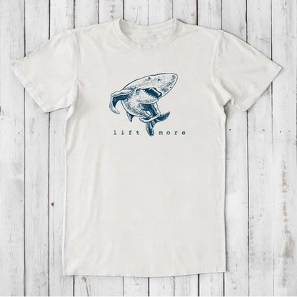White men's graphic t-shirt with shark and 'Lift More' text, made from eco-friendly bamboo and organic cotton blend.