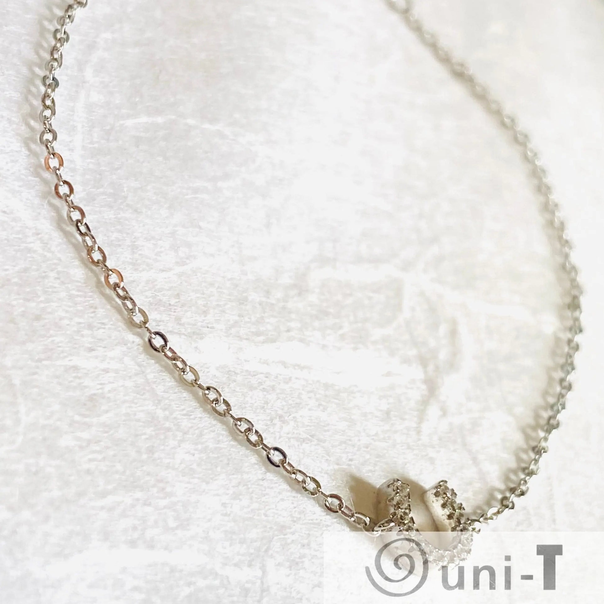 Close-up of Luck Bracelet - Sterling Silver Charm with sparkling horseshoe detail on fine chain. Perfect for gifting or everyday wear.