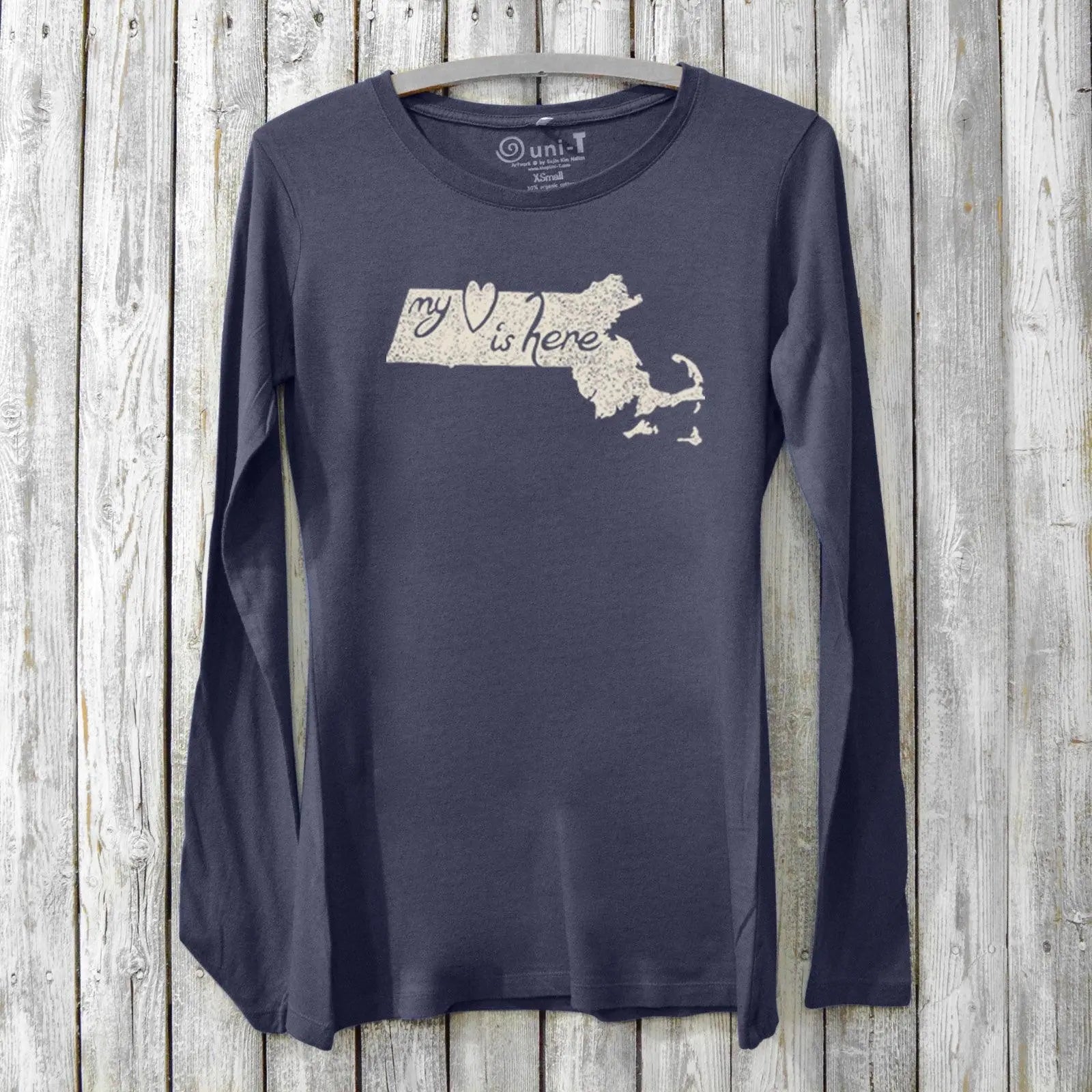 Navy bamboo and organic cotton women's long sleeve t-shirt featuring Massachusetts outline and 'My Heart Is Here' graphic. Soft state pride gift top.