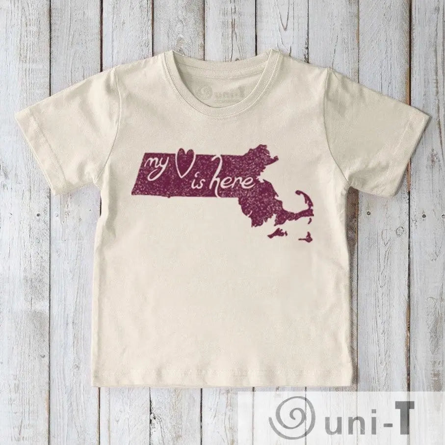 Children's organic cotton T-shirt in cream with maroon Massachusetts state graphic and 'My Heart Is Here' text. Sustainable apparel by Uni-T.