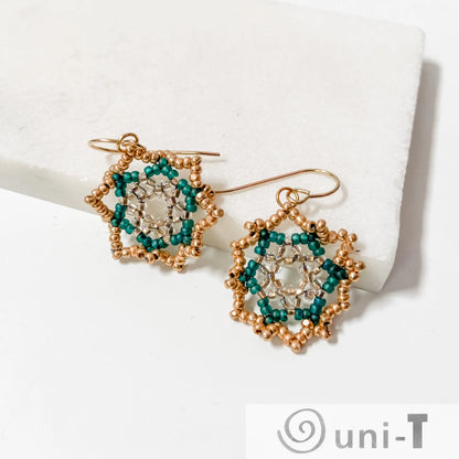 Elegant Green Medallion Earrings made with forest green and gold beads, forming a flower-like medallion on sterling silver hooks.