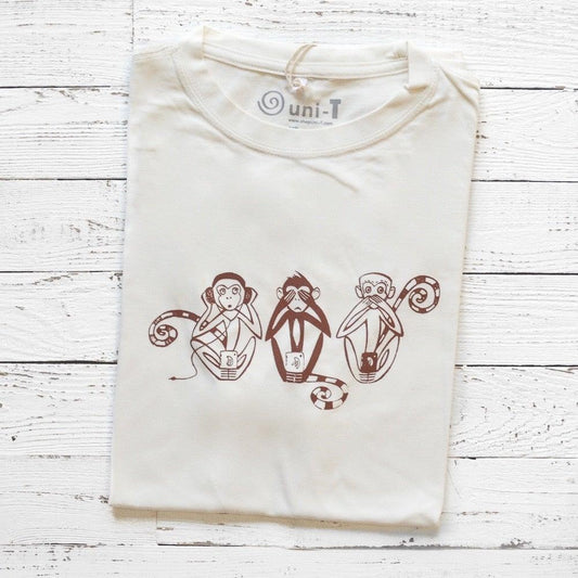 Men's Three Wise Monkeys T-Shirt in bamboo & organic cotton, folded on white wood background with brown monkey graphic print.