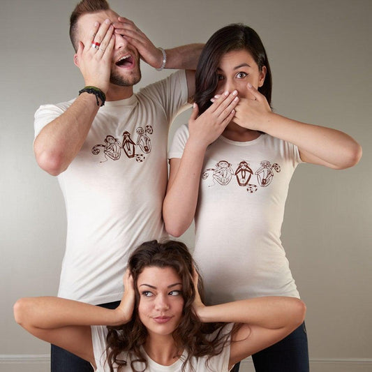 Group wearing Uni-T classic fit 'See No Evil Hear No Evil Speak No Evil' T-shirts, showcasing the symbolic monkey design in cream color.
