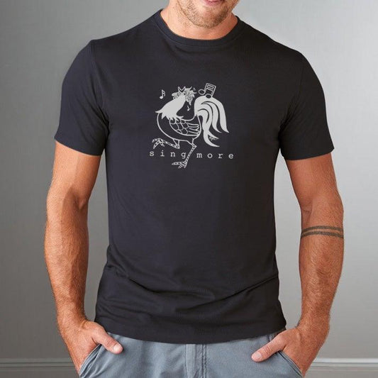 Man wearing black 'Sing More' rooster graphic tee made from bamboo and organic cotton, a humorous gift for early risers.