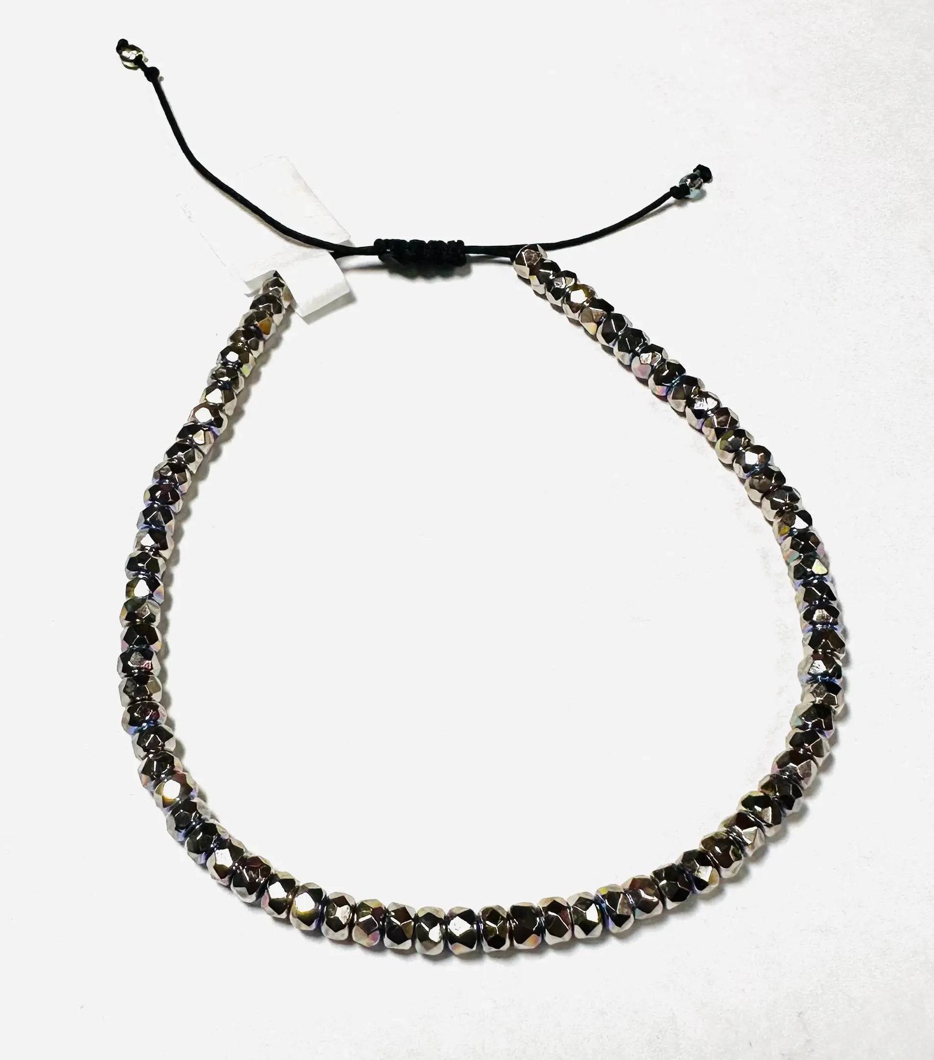 Metallic glass bead adjustable friendship bracelet with black cord. Stackable and stylish, perfect for birthday gifts or fashion use.