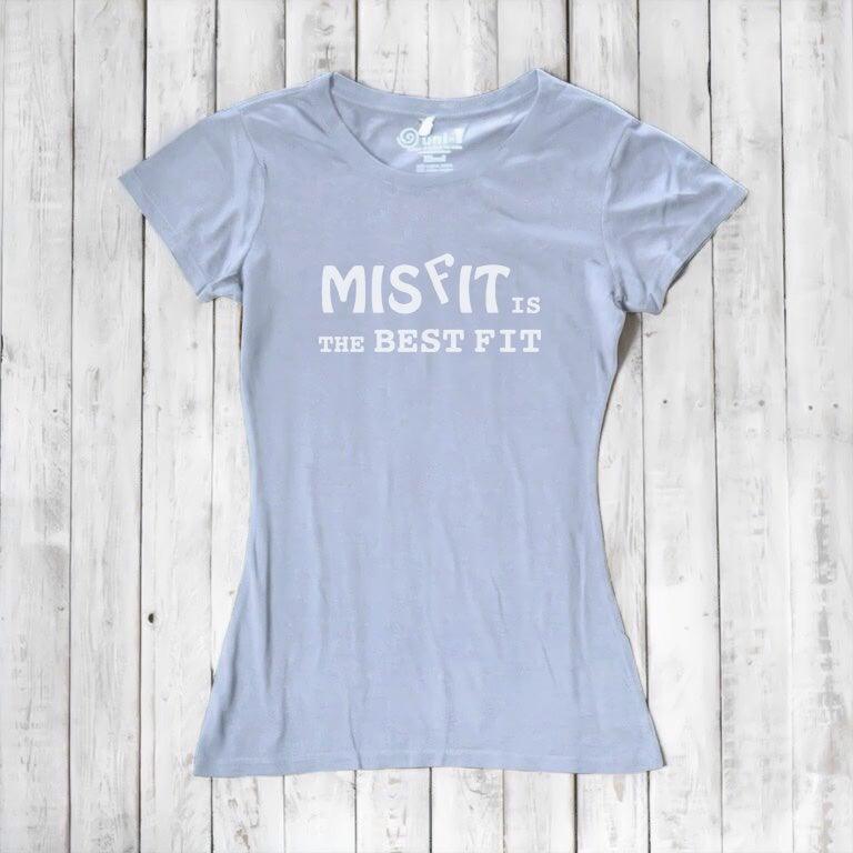 Light blue bamboo and organic cotton women's t-shirt with white 'Misfit is the Best Fit' graphic. Comfortable and empowering fashion.