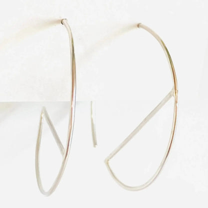 Minimalist sterling silver hoop earrings with geometric bar design. Modern 1” diameter hoops perfect for stylish everyday accessories.
