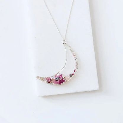 Sterling Silver Moon Necklace with pink crystals and pearls, crescent moon pendant on 18” chain, ideal for stylish gifting.