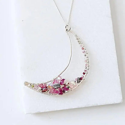 Elegant Moon Necklace Sterling Silver with handcrafted pink tourmaline and freshwater pearls, crescent design on fine 18” chain.