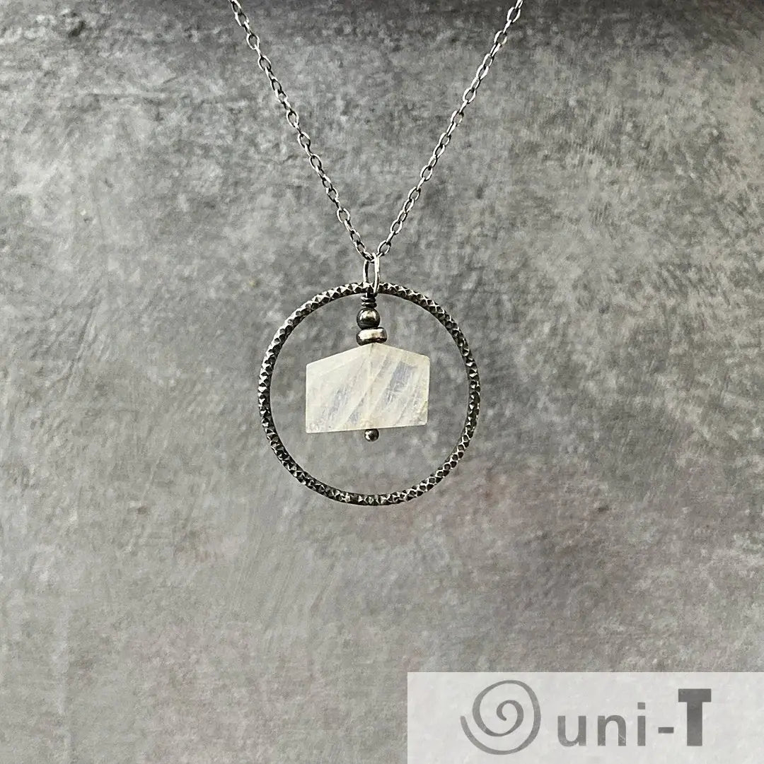 Moonstone Circle Necklace with sterling silver infinity circle and faceted moonstone pendant, perfect for minimalist jewelry lovers.