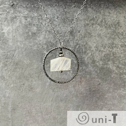 Moonstone Circle Necklace with sterling silver infinity circle and faceted moonstone pendant, perfect for minimalist jewelry lovers.