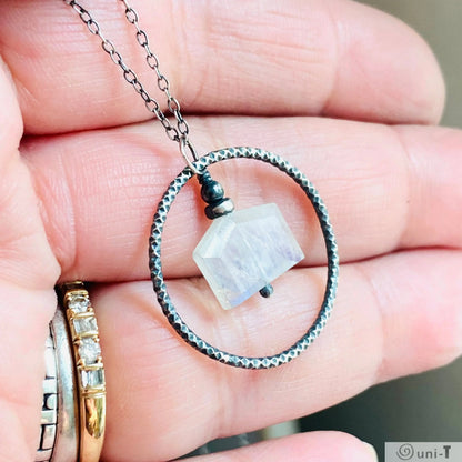 Close-up of Moonstone Infinity Necklace featuring hand-soldered silver circle and moonstone charm, ideal for fashion accessories.