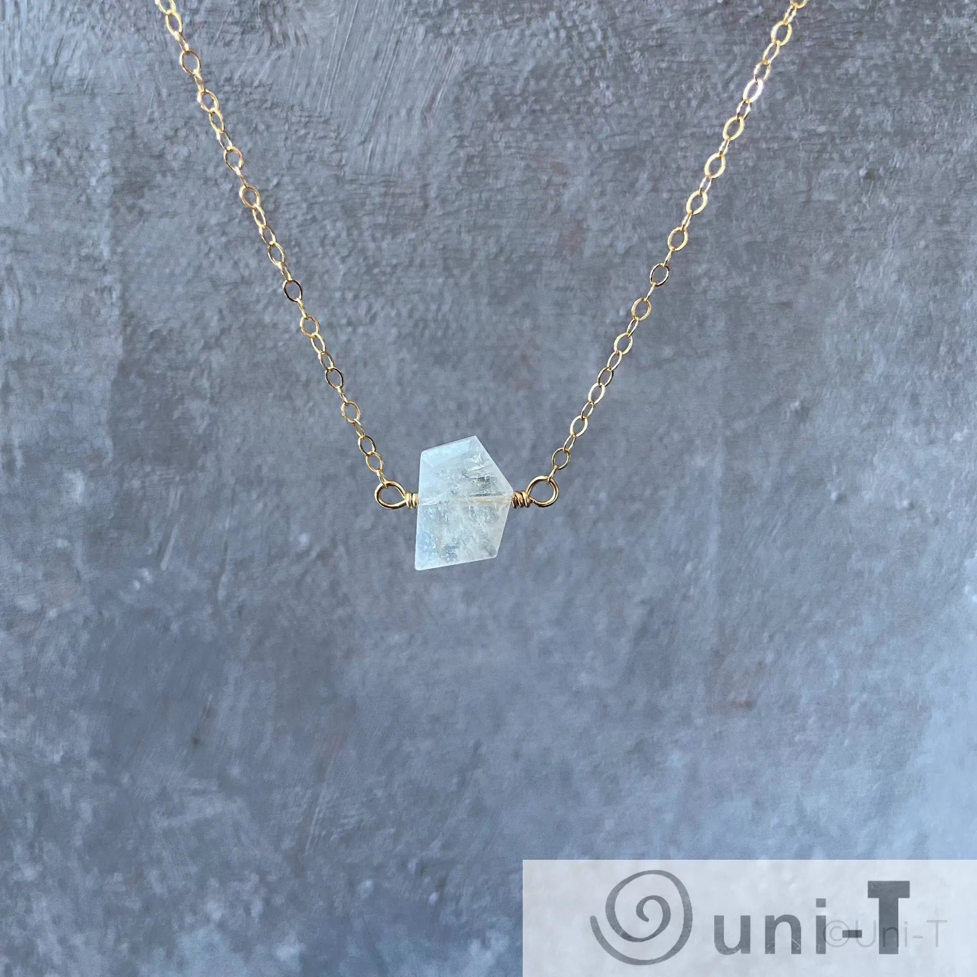 Moonstone gemstone necklace with hand-cut crystal pendant on 18-inch gold-filled chain, highlighting moonstone meaning and elegance.