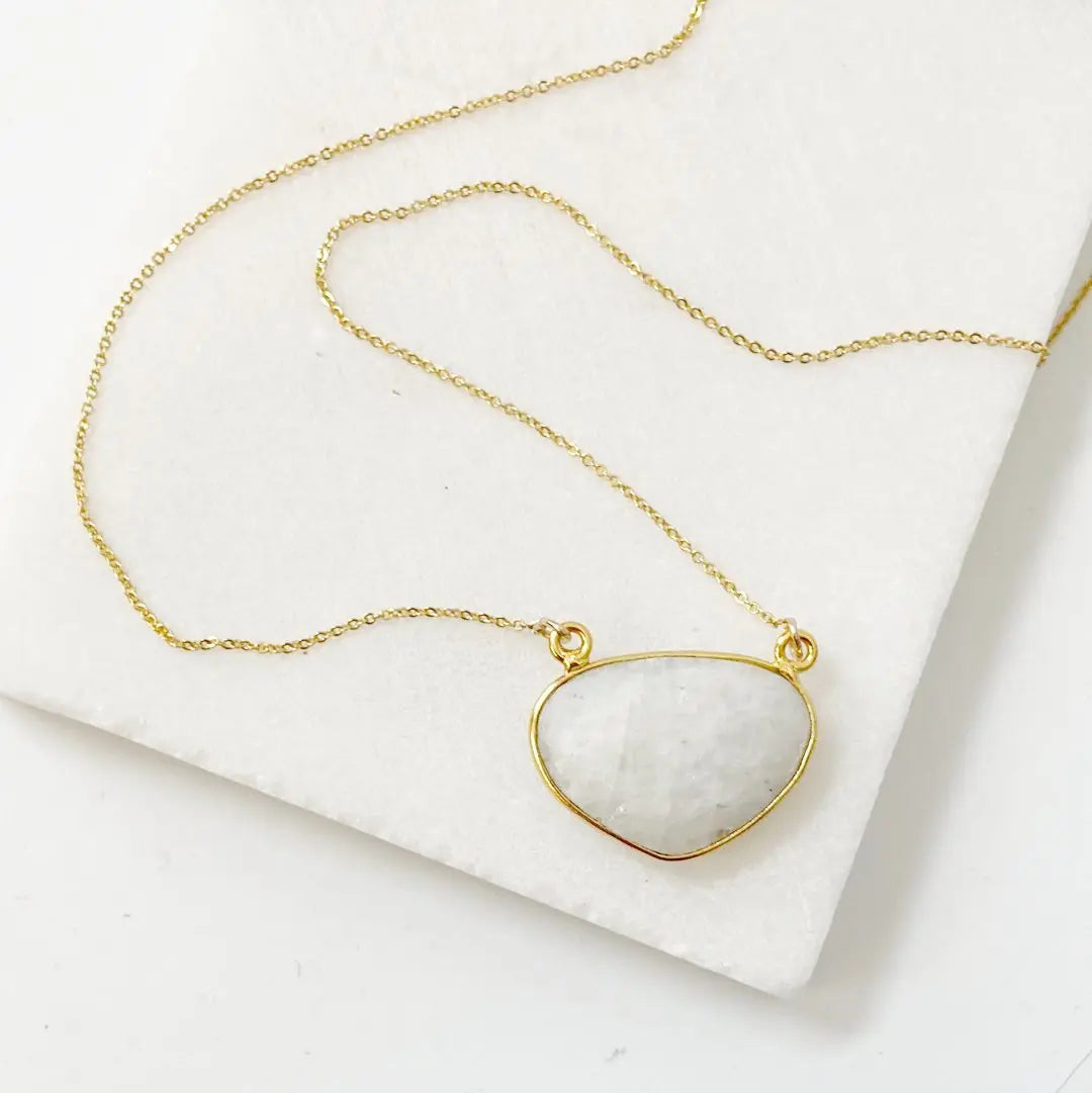 Gold filled moonstone necklace featuring a faceted gemstone pendant on a delicate chain. Adjustable length makes it perfect for layering.