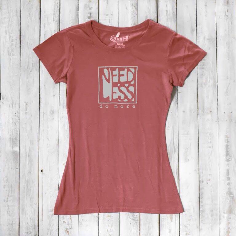 Terracotta red women's bamboo and organic cotton t-shirt with 'Need Less Do More' graphic. Sustainable inspirational gift idea.