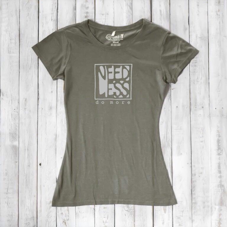 Olive green women's inspirational t-shirt in bamboo and organic cotton. 'Need Less Do More' quote tee for intentional living.