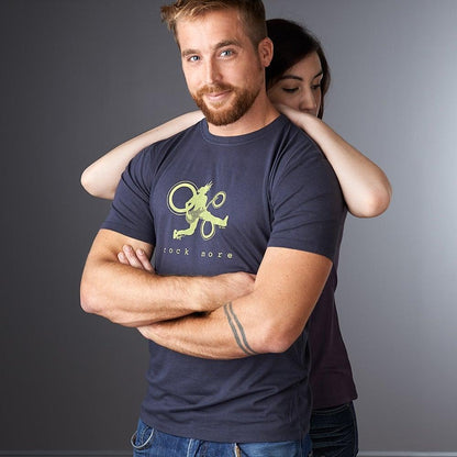 Men's Guitar T-Shirt in Bamboo & Organic Cotton with 'Rock More' graphic in green on navy, modeled by man with woman hugging from behind.