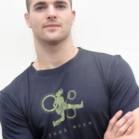 Classic fit 'Rock More' men's guitar T-shirt in navy bamboo cotton blend, featuring green rock and roll graphic, worn by male model.