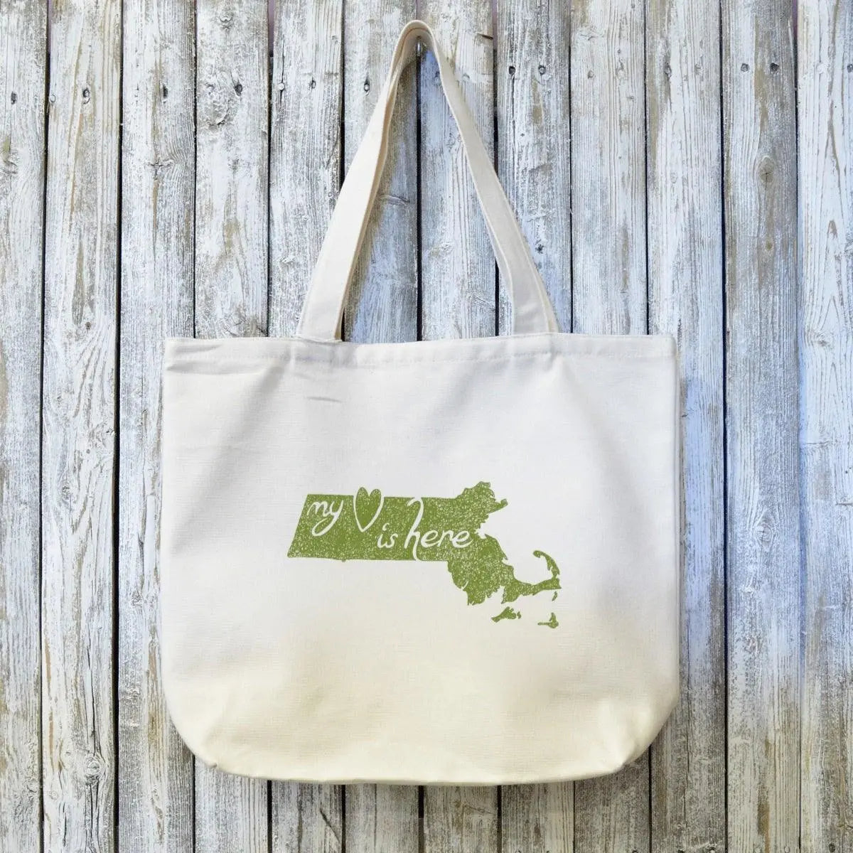 Organic canvas tote bag with green Massachusetts state outline and 'My Heart is Here' text. Eco-friendly Massachusetts gift for locals and travelers.