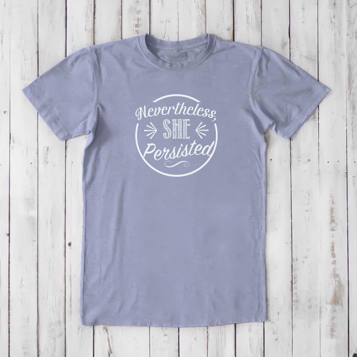 Men's 'She Persisted' T-Shirt in light blue bamboo organic cotton, sustainable graphic tee for feminist support.