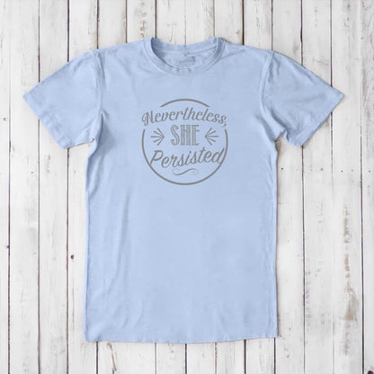Men's 'She Persisted' T-Shirt in pale blue bamboo cotton, subtle feminist graphic tee for sustainable wardrobes.