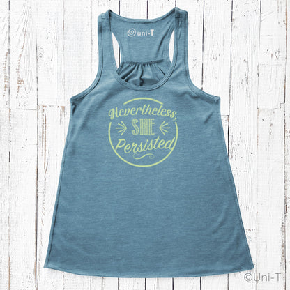 Blue racerback tank top featuring yellow 'Nevertheless She Persisted' graphic. Soft poly-viscose blend for resilient women's fashion.