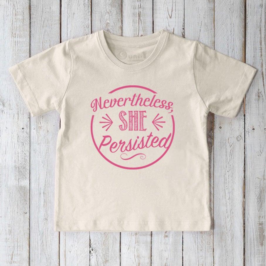 Cream-colored kids' organic cotton T-shirt with pink 'Nevertheless, She Persisted' message. Positive eco-conscious tee by Uni-T for young girls.