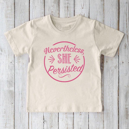 Cream-colored kids' organic cotton T-shirt with pink 'Nevertheless, She Persisted' message. Positive eco-conscious tee by Uni-T for young girls.