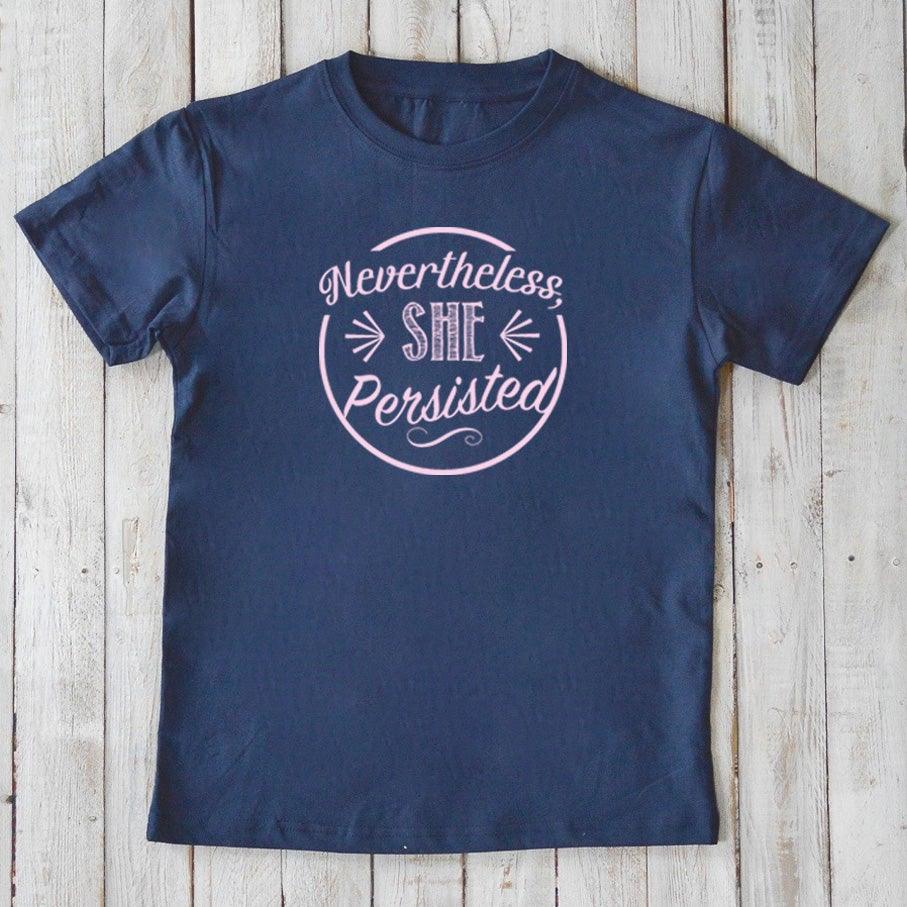 Navy blue kids' organic cotton T-shirt with light pink 'Nevertheless, She Persisted' graphic. Inspirational eco-friendly top by Uni-T.