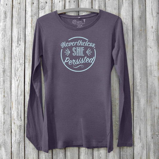 Women's empowerment long sleeve T-shirt in dark purple bamboo and organic cotton with 'Nevertheless She Persisted' graphic. Feminist activist apparel.