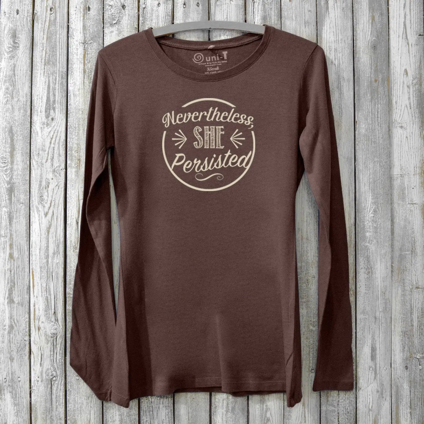 Dark brown women's long sleeve graphic tee made from bamboo and organic cotton with 'Nevertheless She Persisted' design. Empowering activist gift.