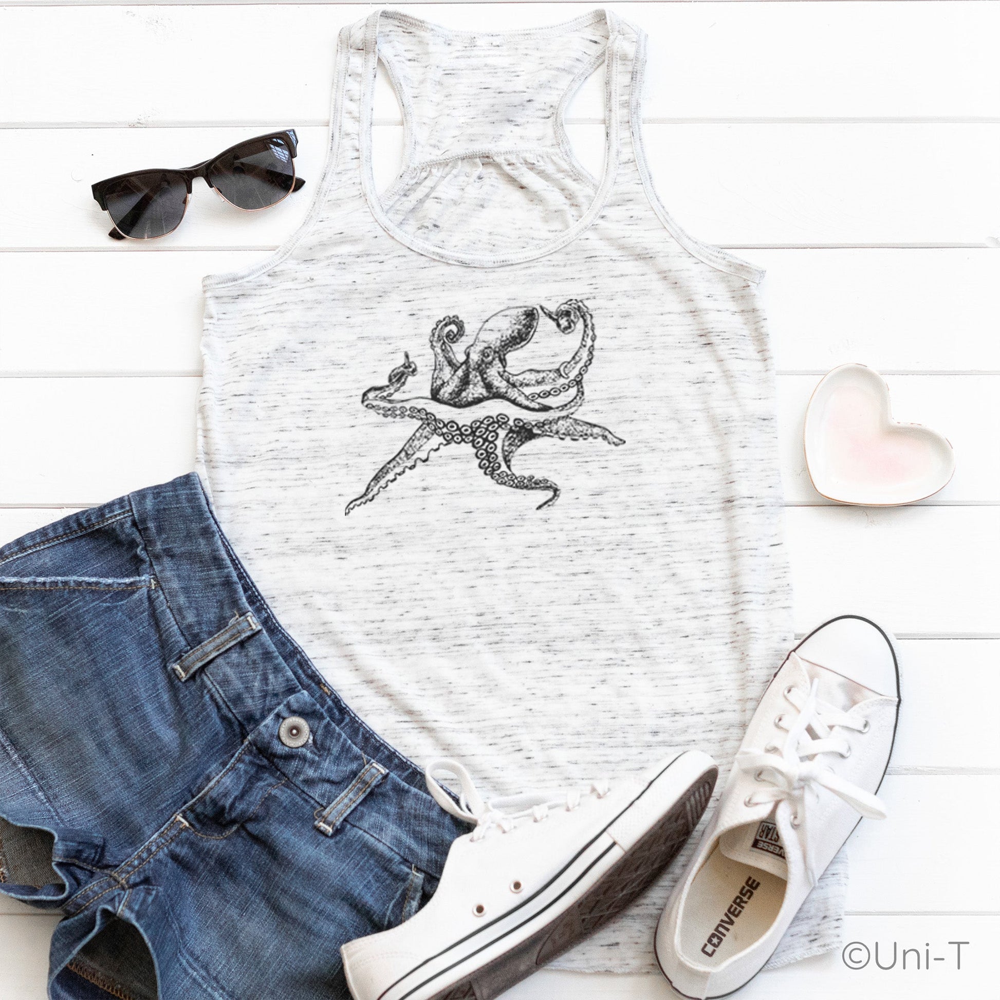 White speckled Octopus Tank Top for Women styled with denim shorts and sneakers. Ocean-inspired casual wear for adaptable spirits.