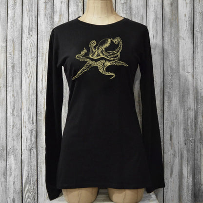 Fitted black Women's Octopus Long Sleeve T-Shirt on mannequin, made of bamboo and organic cotton with gold sea life graphic for eco-conscious style.