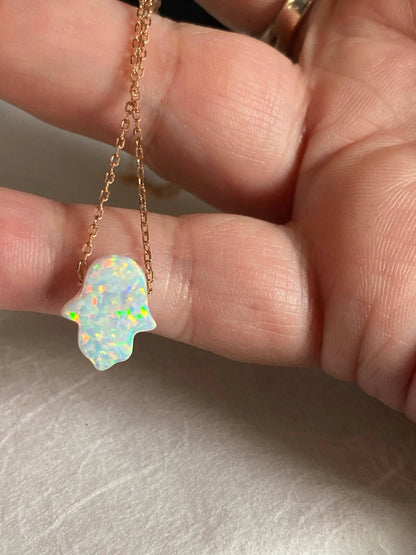 Close-up of Opal October Birthstone Necklace showing iridescent Hamsa charm on rose gold chain, perfect for everyday wear or gifting.