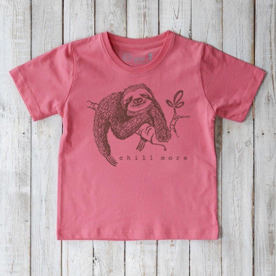 Pink Kids' Organic Cotton Sloth T-Shirt featuring a relaxed sloth and 'chill more' text. Sustainable and soft animal graphic tee for kids.