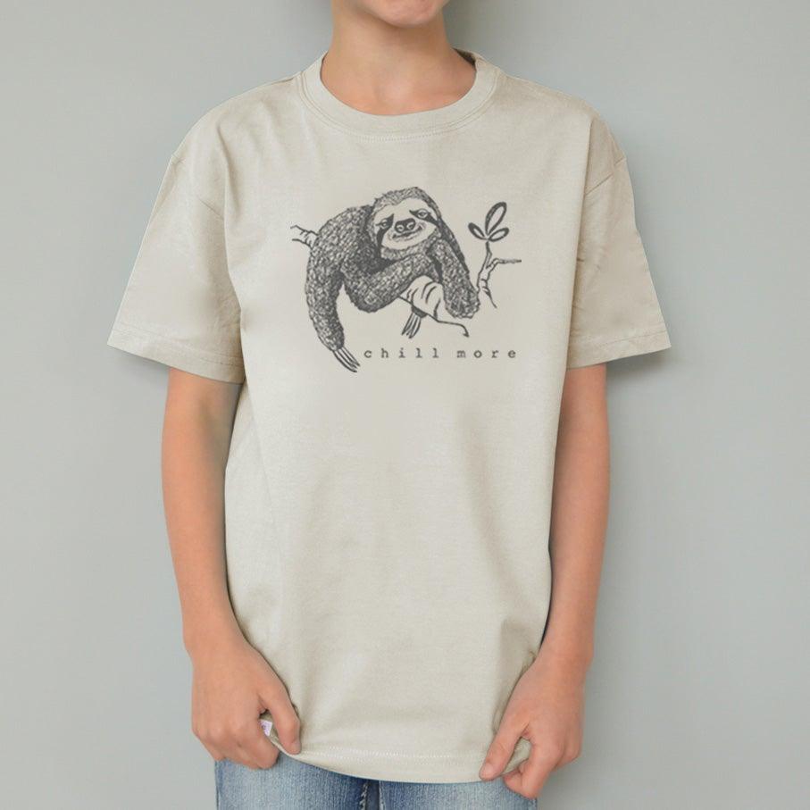 Child wearing cream Kids' Organic Cotton Sloth T-Shirt with 'chill more' graphic. Soft, sustainable animal-themed shirt by Uni-T.