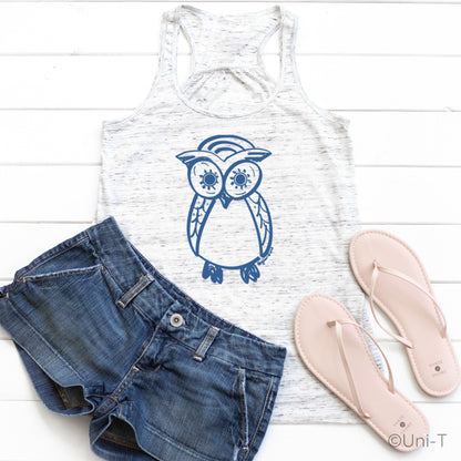 White Owl Flowy Tank Top for Women styled with denim shorts and sandals. Features blue owl graphic, perfect for summer and beachwear.