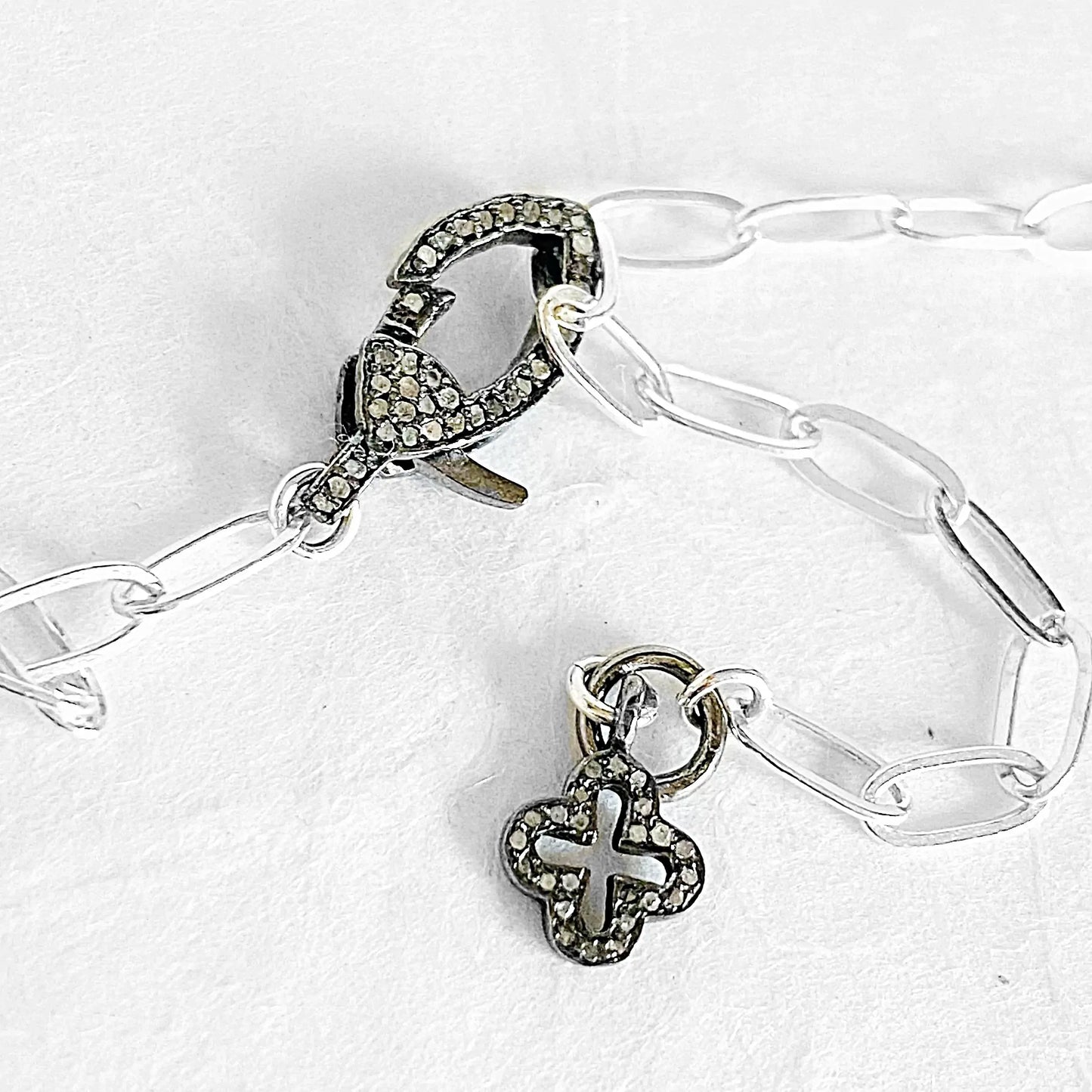 Sterling silver paperclip chain necklace with pave moonstone clasp and antiqued silver charm detail, ideal for layering or solo wear.