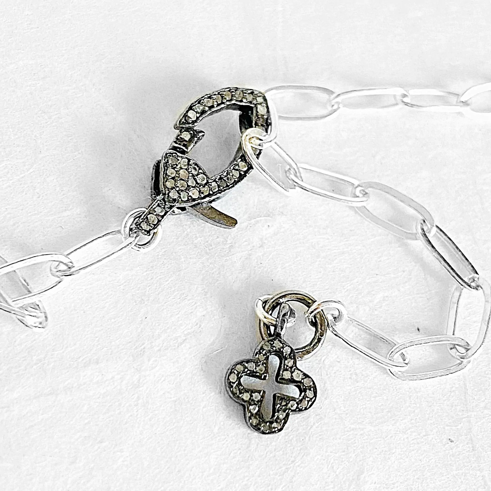 Sterling silver paperclip chain necklace with pave moonstone clasp and antiqued silver charm detail, ideal for layering or solo wear.