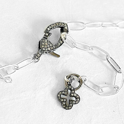 Sterling silver paperclip chain necklace with pave moonstone clasp and antiqued silver charm detail, ideal for layering or solo wear.