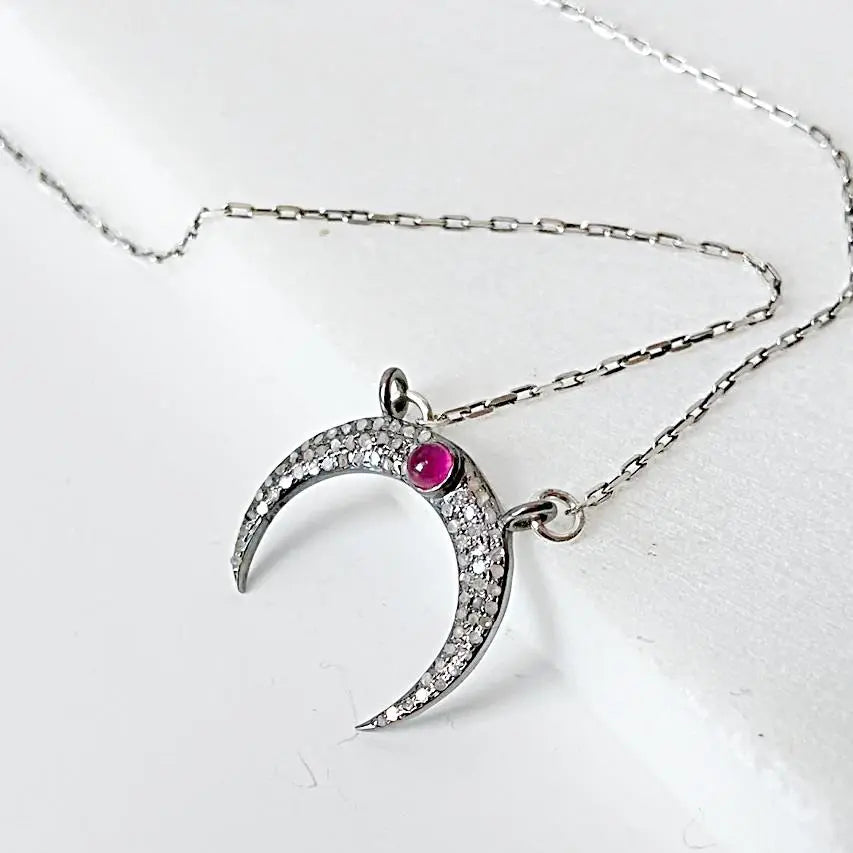 Moonstone ruby necklace with crescent moon pendant in antique sterling silver, featuring pave set moonstone and ruby on 16'' chain.