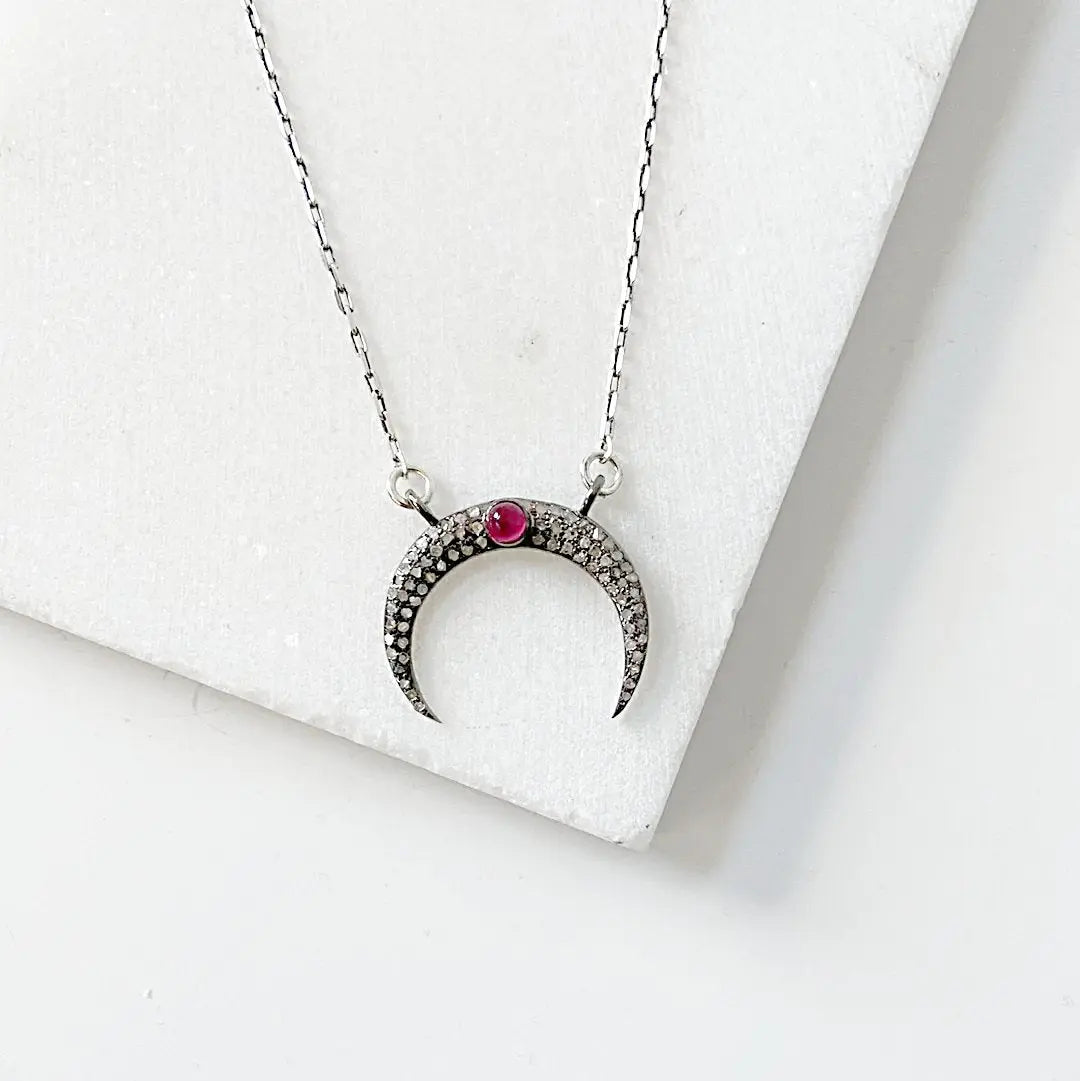 Elegant moonstone ruby necklace in antique sterling silver, showcasing a crescent moon pendant with pave setting on a 16'' chain.