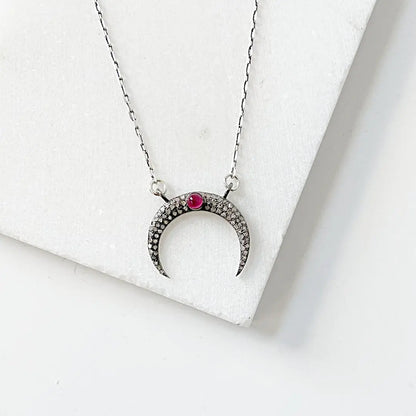 Elegant moonstone ruby necklace in antique sterling silver, showcasing a crescent moon pendant with pave setting on a 16'' chain.