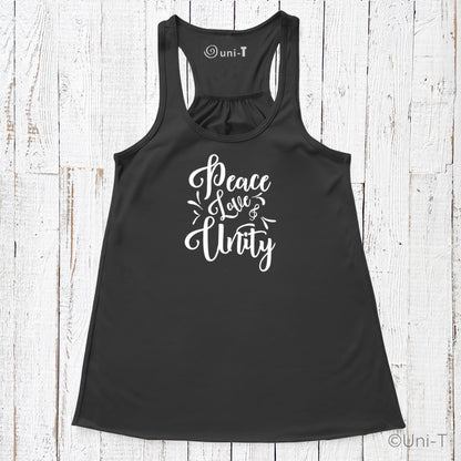Black "Peace Love Unity" Tank Top - Embrace Harmony with white script text, laid flat on a rustic white wooden surface.