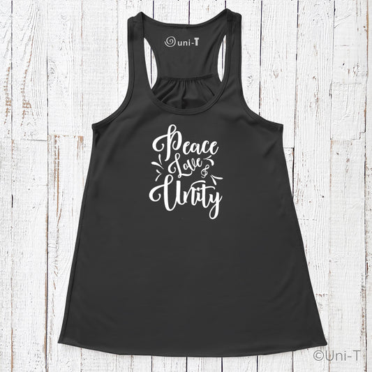 Black "Peace Love Unity" Tank Top - Embrace Harmony with white script text, laid flat on a rustic white wooden surface.