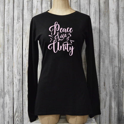Black Women’s Peace Love & Unity Long Sleeve T-Shirt on mannequin, made from bamboo and organic cotton with pink inspirational graphic design.