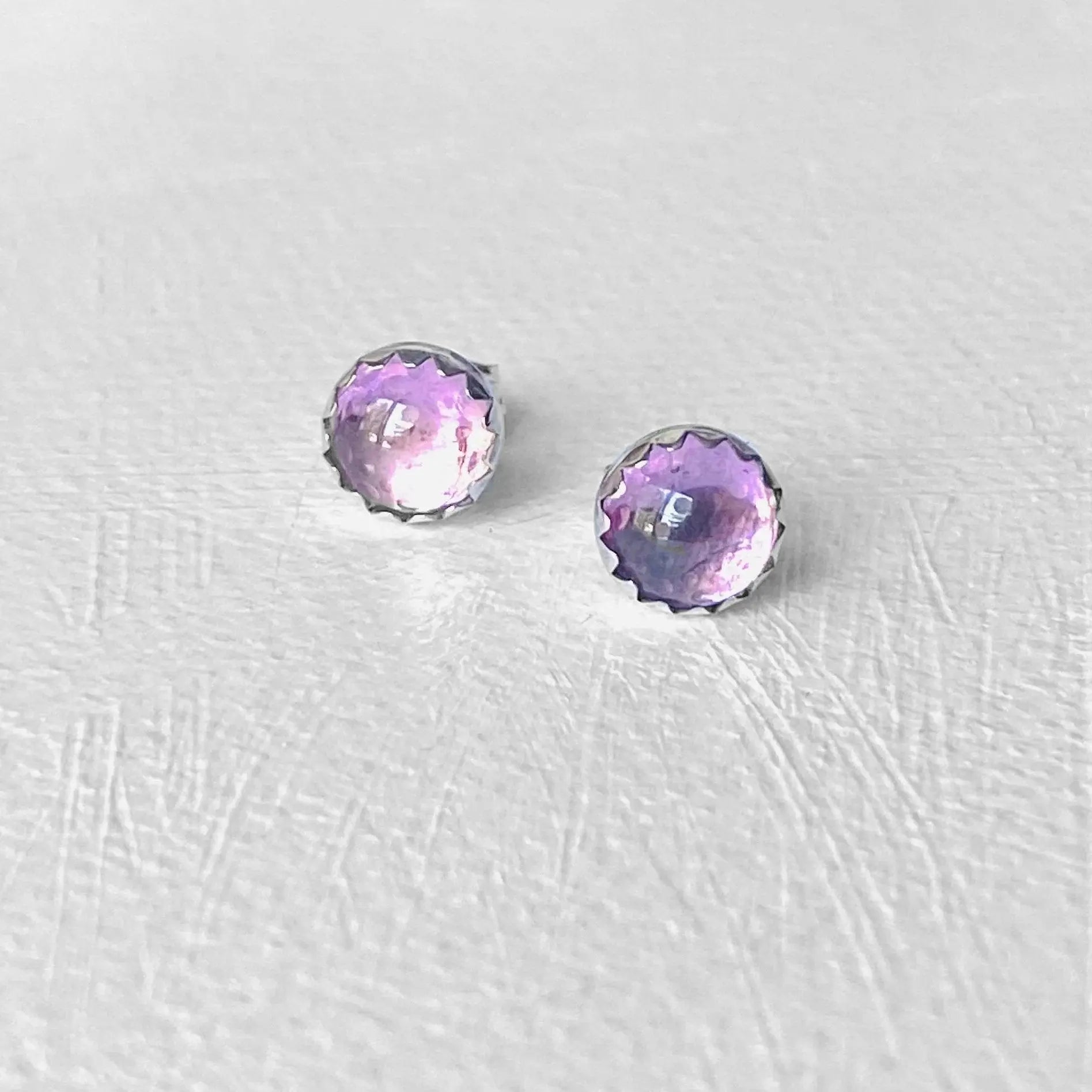 6mm pink cubic zirconia studs with bubble-cut design set in sterling silver. Elegant pink studs ideal for everyday wear or gifting.