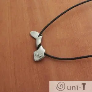 Angled view of Planarian Pendant Jewelry showcasing the flatworm-inspired pendant on a black cord, great for unique accessory collections.